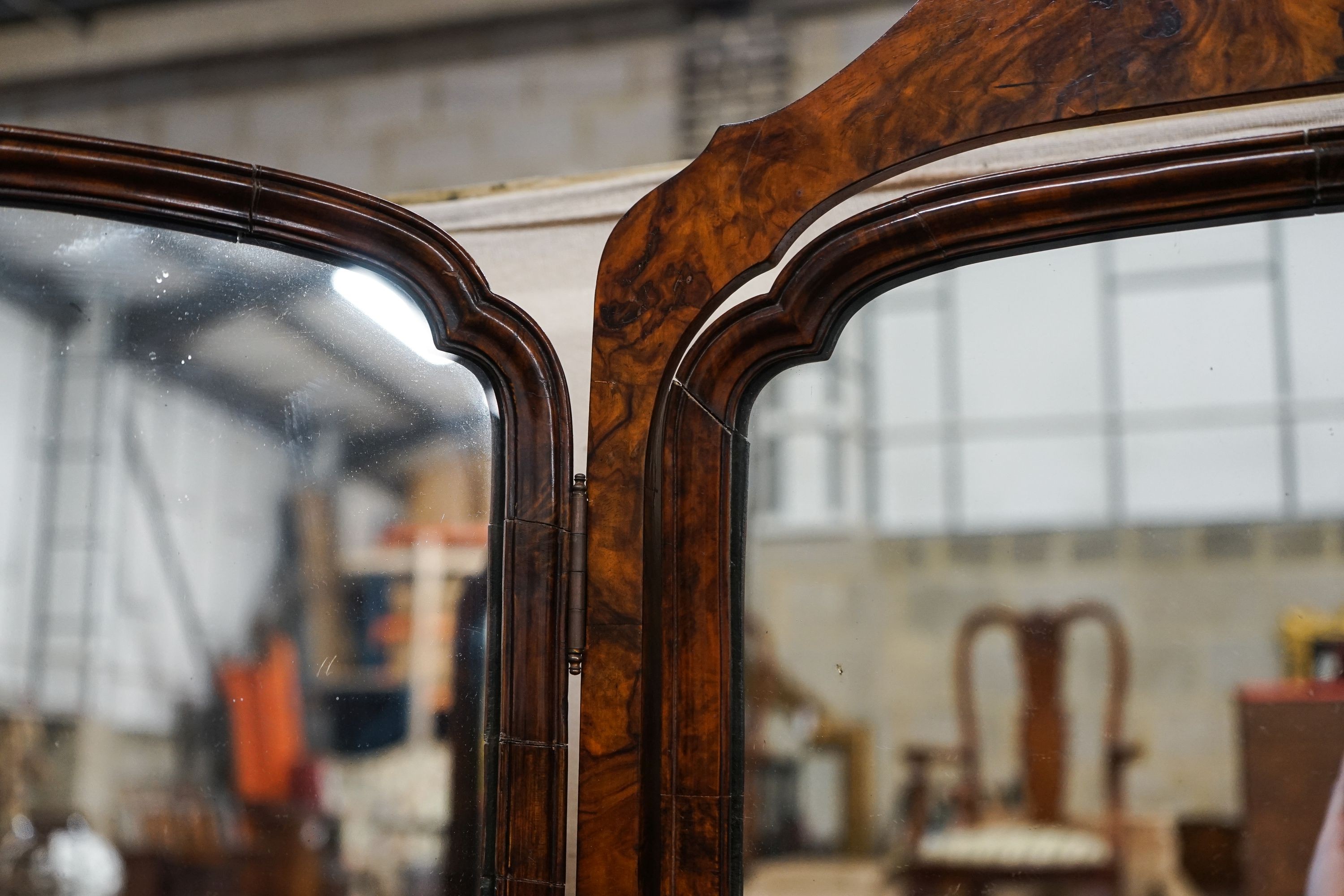 A Queen Anne revival walnut triple dressing table mirror, maximum width 112cm, height 89cm